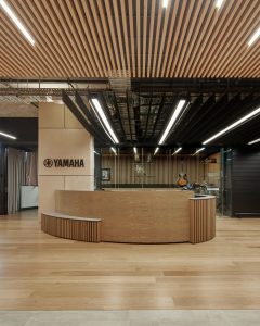 Solid timber batten panels on reception desk.