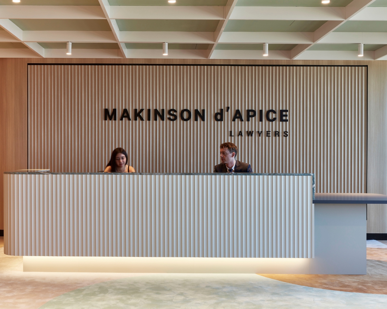 reception desk in law firm with paneling.